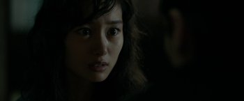 Movie still from “The Outsider” (2018), directed by Martin Zandvliet – A woman's face in the dark; Close Up shot, Over the shoulder angle