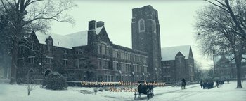 Movie still from “The Pale Blue Eye” (2022), directed by Scott Cooper – An image of an old building with a horse and buggy in front of it; Extreme Wide shot, High angle