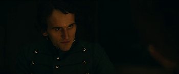 Movie still from “The Pale Blue Eye” (2022), directed by Scott Cooper – A person wearing a jacket; Close Up shot, Low angle