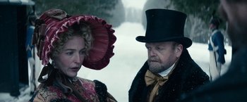 Movie still from “The Pale Blue Eye” (2022), directed by Scott Cooper – A man and a woman dressed in victorian clothing; Close Up shot, Over the shoulder angle