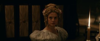 Movie still from “The Pale Blue Eye” (2022), directed by Scott Cooper – A woman in a white dress with flowers in her hair; Close Up shot, Over the shoulder angle