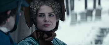 Movie still from “The Pale Blue Eye” (2022), directed by Scott Cooper – A person wearing a wig; Close Up shot, Low angle