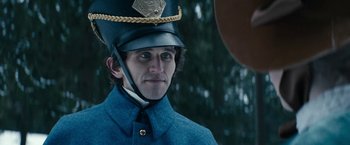 Movie still from “The Pale Blue Eye” (2022), directed by Scott Cooper – A man wearing a uniform and a hat; Close Up shot, Over the shoulder angle