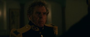 Movie still from “The Pale Blue Eye” (2022), directed by Scott Cooper – An older man in a military uniform stares into the camera; Close Up shot, Over the shoulder angle