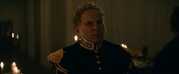 Movie still from “The Pale Blue Eye” (2022), directed by Scott Cooper – A person wearing a uniform; Close Up shot, Low angle