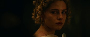 Movie still from “The Pale Blue Eye” (2022), directed by Scott Cooper – A person wearing a dress; Close Up shot, Over the shoulder angle