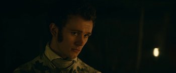 Movie still from “The Pale Blue Eye” (2022), directed by Scott Cooper – A person wearing a shirt and tie; Close Up shot, Over the shoulder angle