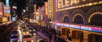 Movie still from “The Prom” (2020), directed by Ryan Murphy – A crowd of people walking down a street; Extreme Wide shot, High angle