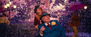 Movie still from “The Prom” (2020), directed by Ryan Murphy – A man and a woman are sitting on a chair; Medium shot, Low angle