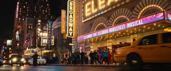 Movie still from “The Prom” (2020), directed by Ryan Murphy – A group of people standing on the side of a building; Extreme Wide shot, High angle