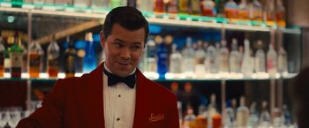 Movie still from “The Prom” (2020), directed by Ryan Murphy – A man wearing a red jacket and a bow tie; Medium shot, Over the shoulder angle