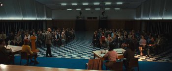 Movie still from “The Prom” (2020), directed by Ryan Murphy – A group of people sitting in front of an audience in a room; Extreme Wide shot, High angle