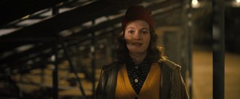 Movie still from “The Prom” (2020), directed by Ryan Murphy – A woman wearing a red hat and a yellow jacket; Medium shot, Low angle