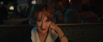 Movie still from “The Prom” (2020), directed by Ryan Murphy – A person sitting in a room; Close Up shot, Over the shoulder angle