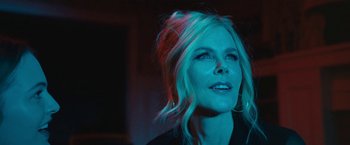 Movie still from “The Prom” (2020), directed by Ryan Murphy – A woman with blonde hair is looking up at the sky; Close Up shot, Low angle