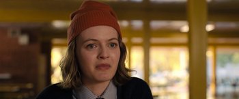 Movie still from “The Prom” (2020), directed by Ryan Murphy – A woman wearing a red hat and a tie; Close Up shot, Over the shoulder angle