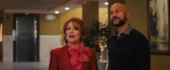 Movie still from “The Prom” (2020), directed by Ryan Murphy – A woman and a man standing next to each other in a room; Medium shot, Low angle