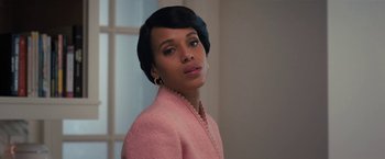 Movie still from “The Prom” (2020), directed by Ryan Murphy – A woman in a pink jacket is standing in a room; Close Up shot, Over the shoulder angle