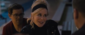 Movie still from “The Prom” (2020), directed by Ryan Murphy – A woman with blonde hair wearing a black jacket; Close Up shot, Over the shoulder angle