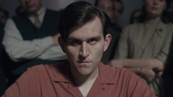 Movie still from “The Queen's Gambit” (2020), directed by Scott Frank – A person wearing a red shirt; Close Up shot, Over the shoulder angle