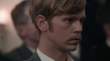 A person wearing a suit and tie