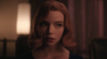 Movie still from “The Queen's Gambit” (2020), directed by Scott Frank – A person with red curly hair; Close Up shot, Over the shoulder angle
