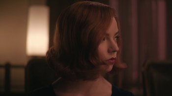 Movie still from “The Queen's Gambit” (2020), directed by Scott Frank – A person wearing a dress; Close Up shot, Low angle