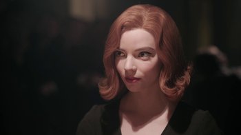 Movie still from “The Queen's Gambit” (2020), directed by Scott Frank – A person wearing a black shirt; Close Up shot, Over the shoulder angle