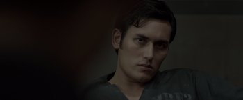 Movie still from “The Raid 2” (2014), directed by Gareth Evans – A person wearing a black shirt; Close Up shot, Low angle