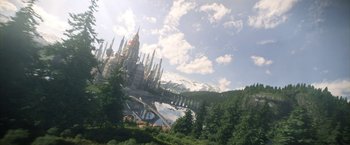 Movie still from “The Sandman” (2022), created by Neil Gaiman – An image of a castle in the middle of a forest; Extreme Wide shot, High angle