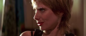 Movie still from “Pulp Fiction” (1994), directed by Quentin Tarantino – A person wearing a black shirt; Close Up shot, Low angle