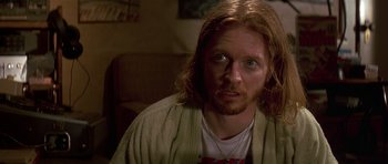 Movie still from “Pulp Fiction” (1994), directed by Quentin Tarantino – A person with long red hair; Close Up shot, Over the shoulder angle