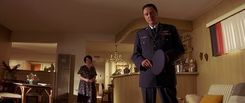 Movie still from “Pulp Fiction” (1994), directed by Quentin Tarantino – A man and a woman standing in a living room; Medium shot, Low angle