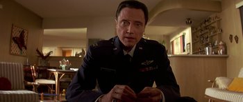 Movie still from “Pulp Fiction” (1994), directed by Quentin Tarantino – A person wearing a uniform; Close Up shot, Low angle