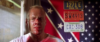 Movie still from “Pulp Fiction” (1994), directed by Quentin Tarantino – A man with blood all over his face; Close Up shot, Low angle