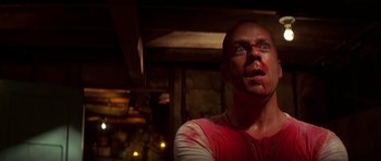 Movie still from “Pulp Fiction” (1994), directed by Quentin Tarantino – A man with blood all over his face; Close Up shot, Low angle