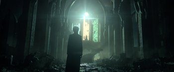Movie still from “The Sandman” (2022), created by Neil Gaiman – A man standing in the middle of an abandoned building; Wide shot, Low angle