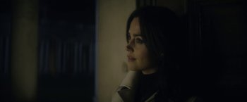 Movie still from “The Sandman” (2022), created by Neil Gaiman – A beautiful woman with long dark brown hair looking to her left; Close Up shot, Over the shoulder angle