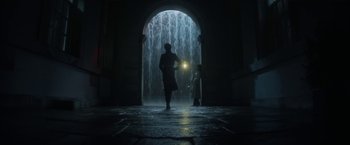 Movie still from “The Sandman” (2022), created by Neil Gaiman – A man and a child are walking through a tunnel; Extreme Wide shot, Low angle