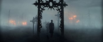 Movie still from “The Sandman” (2022), created by Neil Gaiman – A group of people walking through a foggy area; Extreme Wide shot, High angle