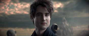 Movie still from “The Sandman” (2022), created by Neil Gaiman – A person wearing a jacket; Close Up shot, Over the shoulder angle