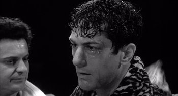 Movie still from “Raging Bull” (1980), directed by Martin Scorsese – Black and white photograph of a man with wet hair; Close Up shot, Low angle