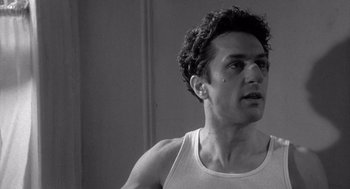 Movie still from “Raging Bull” (1980), directed by Martin Scorsese – Black and white photograph of a man in a tank top; Close Up shot, Low angle