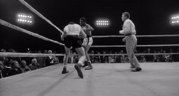 Movie still from “Raging Bull” (1980), directed by Martin Scorsese – Two men in a boxing ring during a boxing match; Wide shot, Low angle