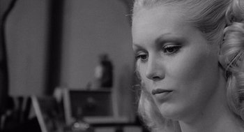 Movie still from “Raging Bull” (1980), directed by Martin Scorsese – A person wearing a dress; Close Up shot, Over the shoulder angle