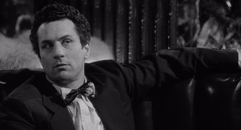 Movie still from “Raging Bull” (1980), directed by Martin Scorsese – A black and white photo of a man in a tuxedo; Close Up shot, Low angle