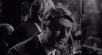 Movie still from “Raging Bull” (1980), directed by Martin Scorsese – Black and white photograph of a man in a suit; Close Up shot, Over the shoulder angle