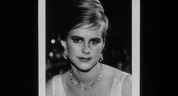 Movie still from “Raging Bull” (1980), directed by Martin Scorsese – A black - and - white photo of a woman wearing a necklace and earrings; Close Up shot, Low angle