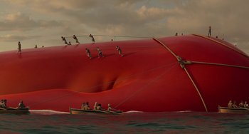 Movie still from “The Sea Beast” (2022), directed by Chris Williams – A group of people on a boat in the water; Extreme Wide shot, Overhead angle