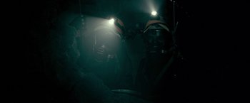 Movie still from “The Silence” (2019), directed by John R. Leonetti – A couple of people that are in the dark; Medium shot, Low angle